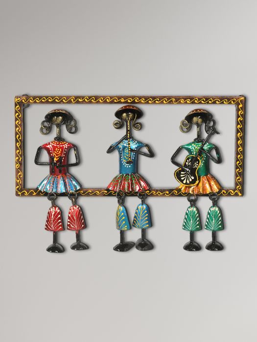 Hand made Wall decor of three lady musicians sitting on a ledge with dangling feet