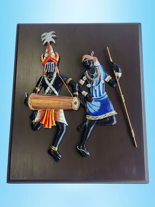 Handmade wall decor of dancing tribal musician couple