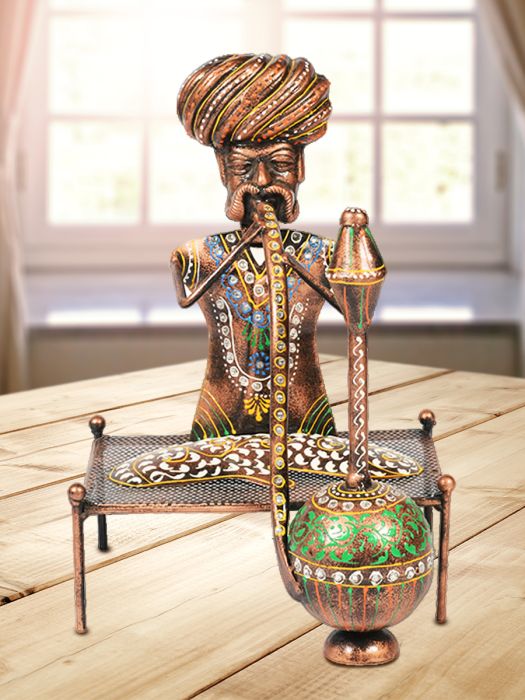 Handmade Table decor of village headman seated in a traditional charpai